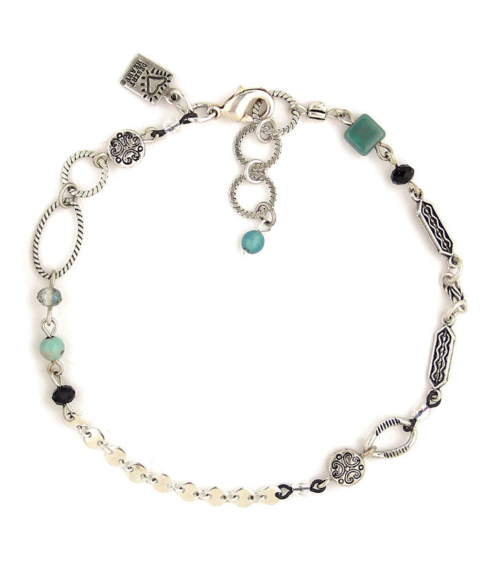 A nice combo of elements joined together to create an interesting little work of art to adorn your ankle. Includes pewter, glass, crystal and sterling plated and antiqued brass.  9”-9.75”