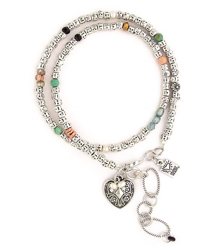The comfortable weight of this piece is due to all the pewter beads. In between are trade beads, freshwater pearls, turquoise, glass and copper. Double wrap for a really nice bracelet, or wear as a simply elegant necklace. Just under 15”-17”