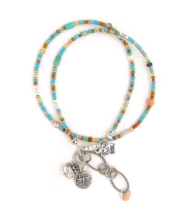 Over 200 multi-colored seed beads are strung together here with lovely accents of turquoise, freshwater pearl, glass, pewter and copper. A perfect ‘everyday’ adornment whether by land or sea. An ornate pewter bead and delightful dragonfly add to the charm :) 14.75”-16.5”